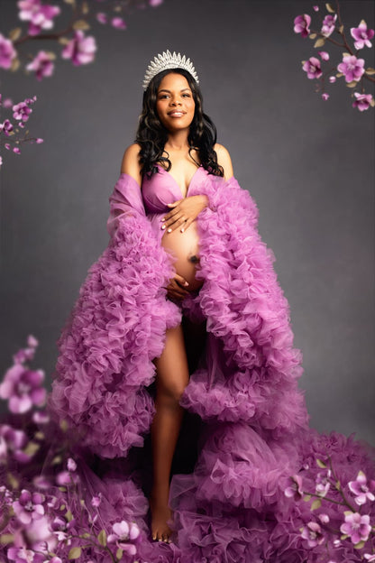 Elegant maternity portrait of a stunning mom-to-be wearing a luxurious fluffy gown and crown, radiating beauty and grace in a serene studio setting. Captured by LiMia Photography, a Maternity Photographer Cape Town, highlighting the beauty of motherhood.