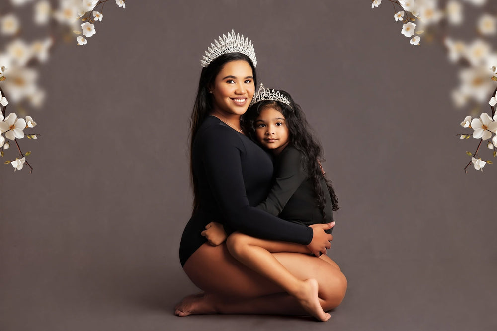 Mom Sitting with her daughter on her lap