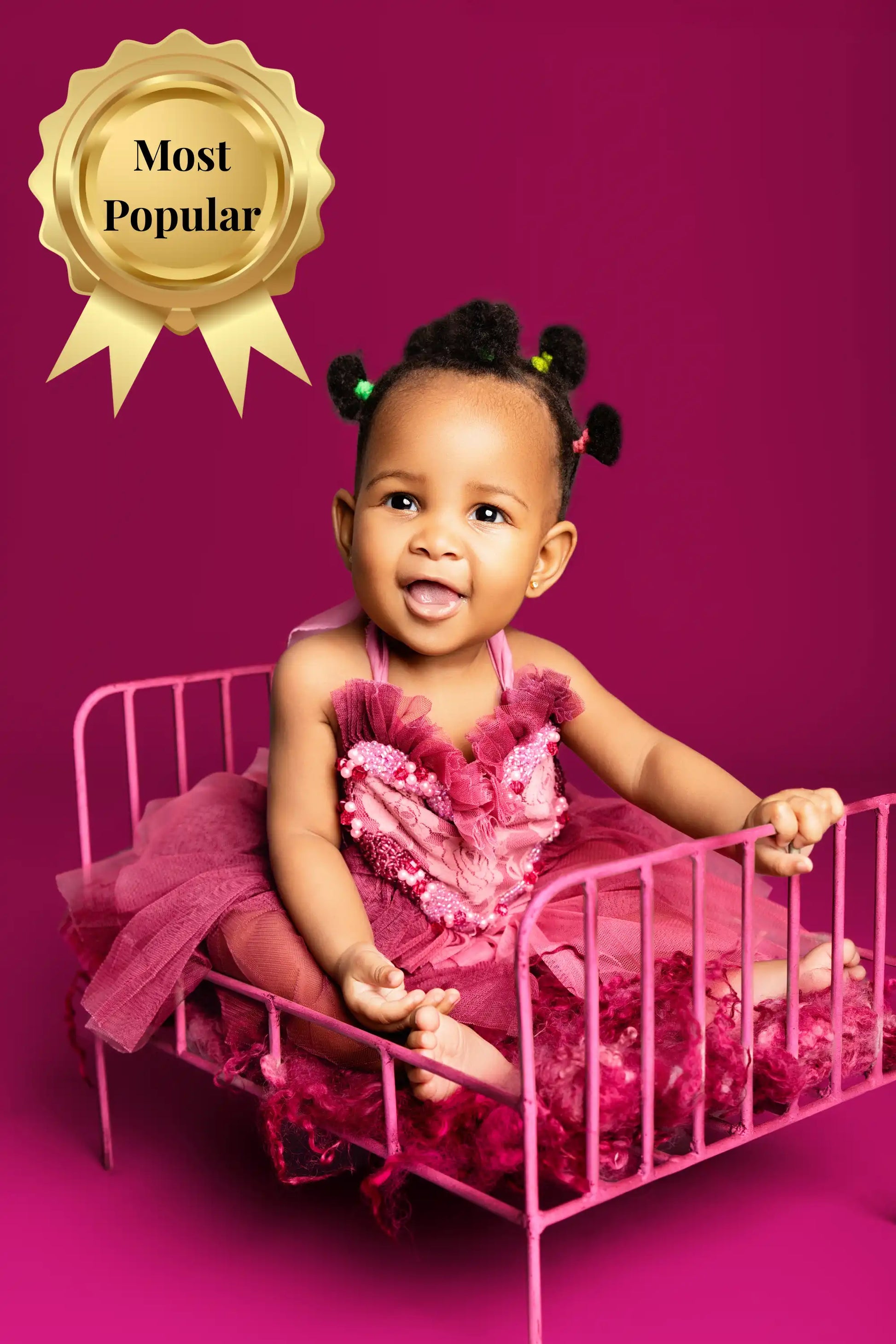 Child in a pink dress sitting on a small pink bed against a purple background with 'Most Popular' badge.